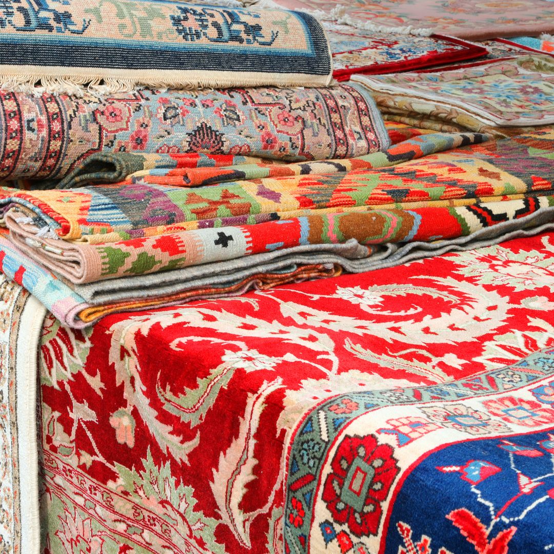 Variety of oriental rugs with various patterns and colors. 