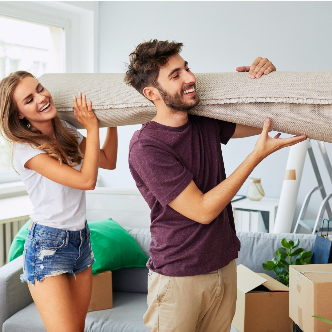 image of people carrying carpet