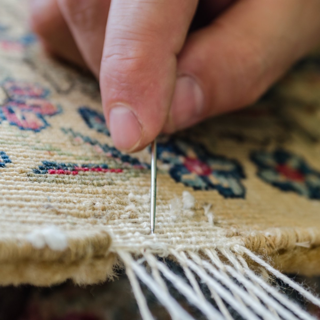 image of a rug being reweaved