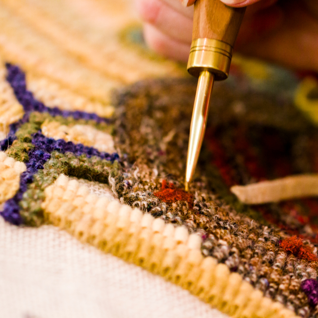 A rug being repaired