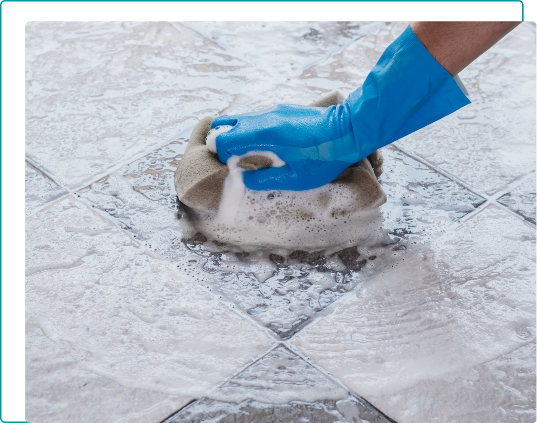 Tile Cleaning in Mercer Island (4) a person scrubbing a tile floor with soap