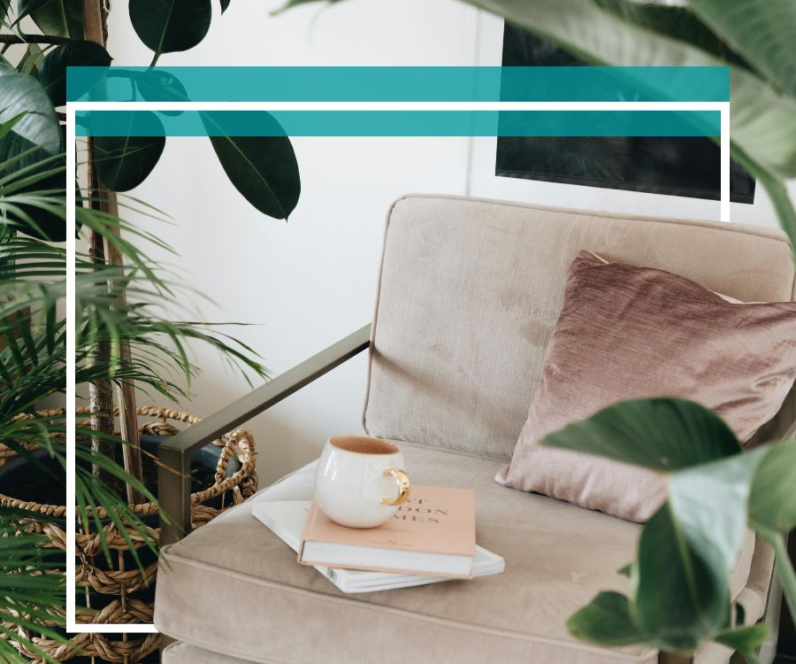 Beige chair with coffe cup and plants